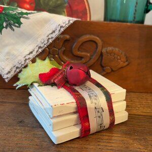 Stack of vintage-style miniature decorative books Christmas home decor
